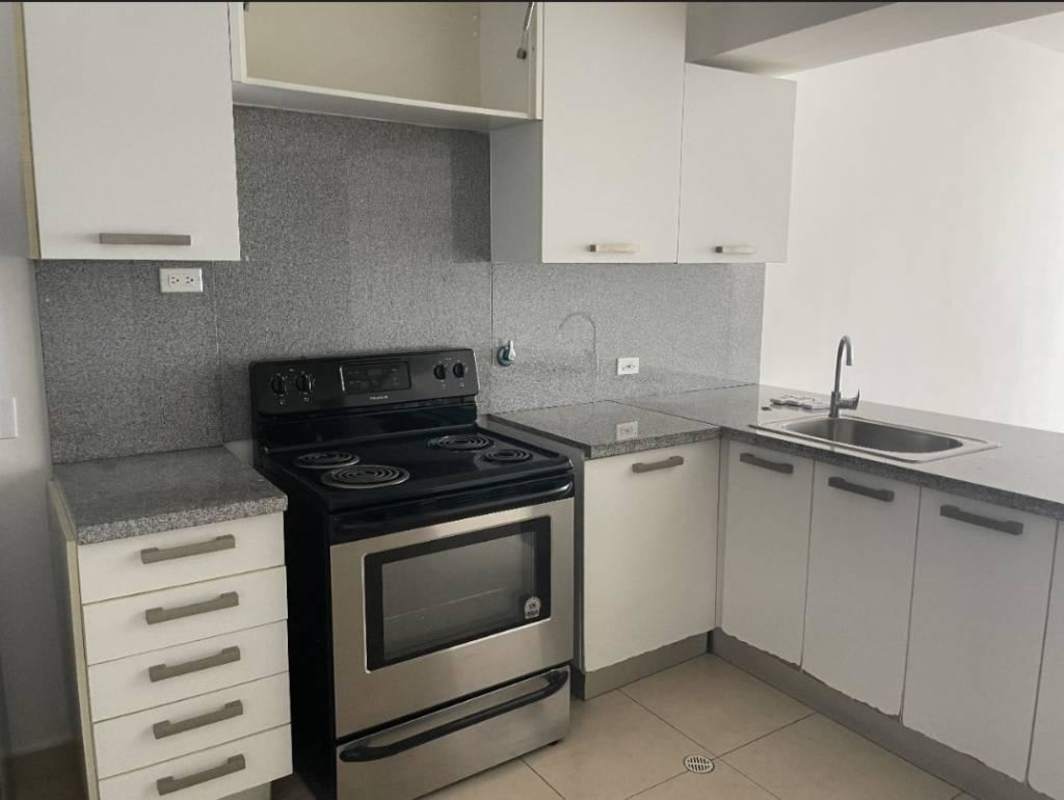 Open American style kitchen with granite counters and appliances PH White Tower in Marbella Panama