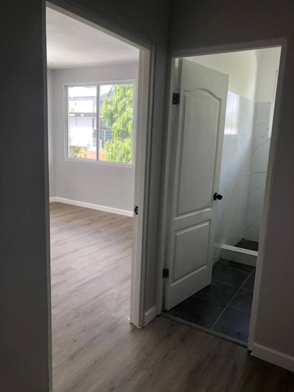 Modern bedroom with built-in wardrobe, large window natural lighting, Obarrio Panama City for rent