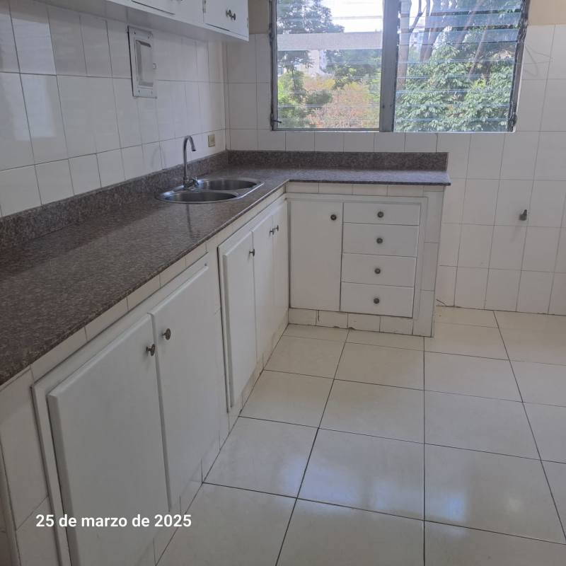 Bright kitchen with double sink granite countertops large window PH Plaza España Panama City