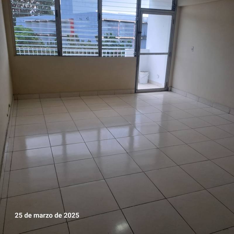 Living room with tile floors, large windows and balcony access PH Plaza España Panama