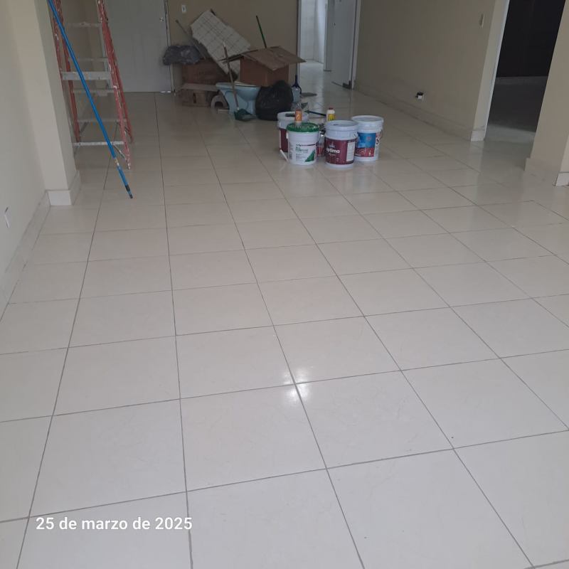 Balcony with white tiles and curved railing overlooking street PH Plaza España Panama