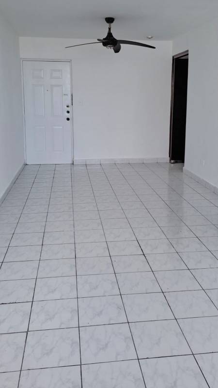 Interior hallway with white tiles apartment rental PH Torres del Sol Panama City