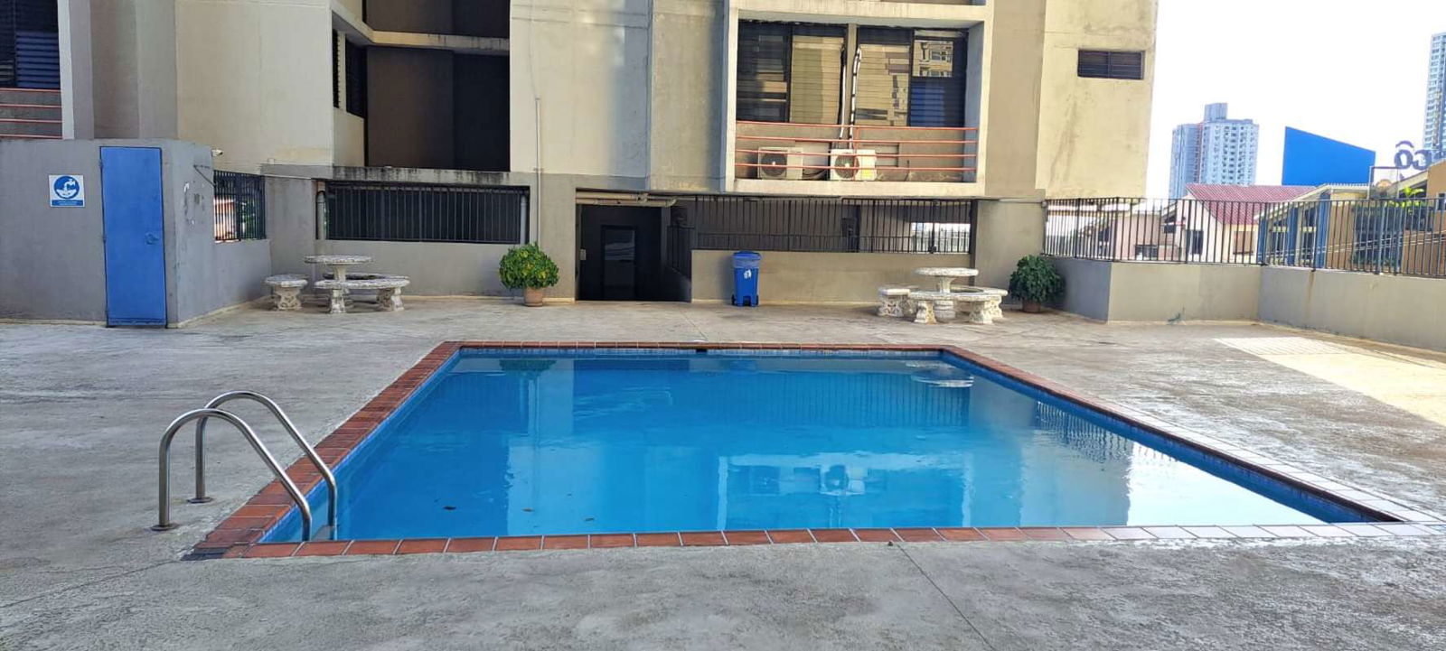 Swimming pool area with city views apartment complex PH Torres del Sol Panama