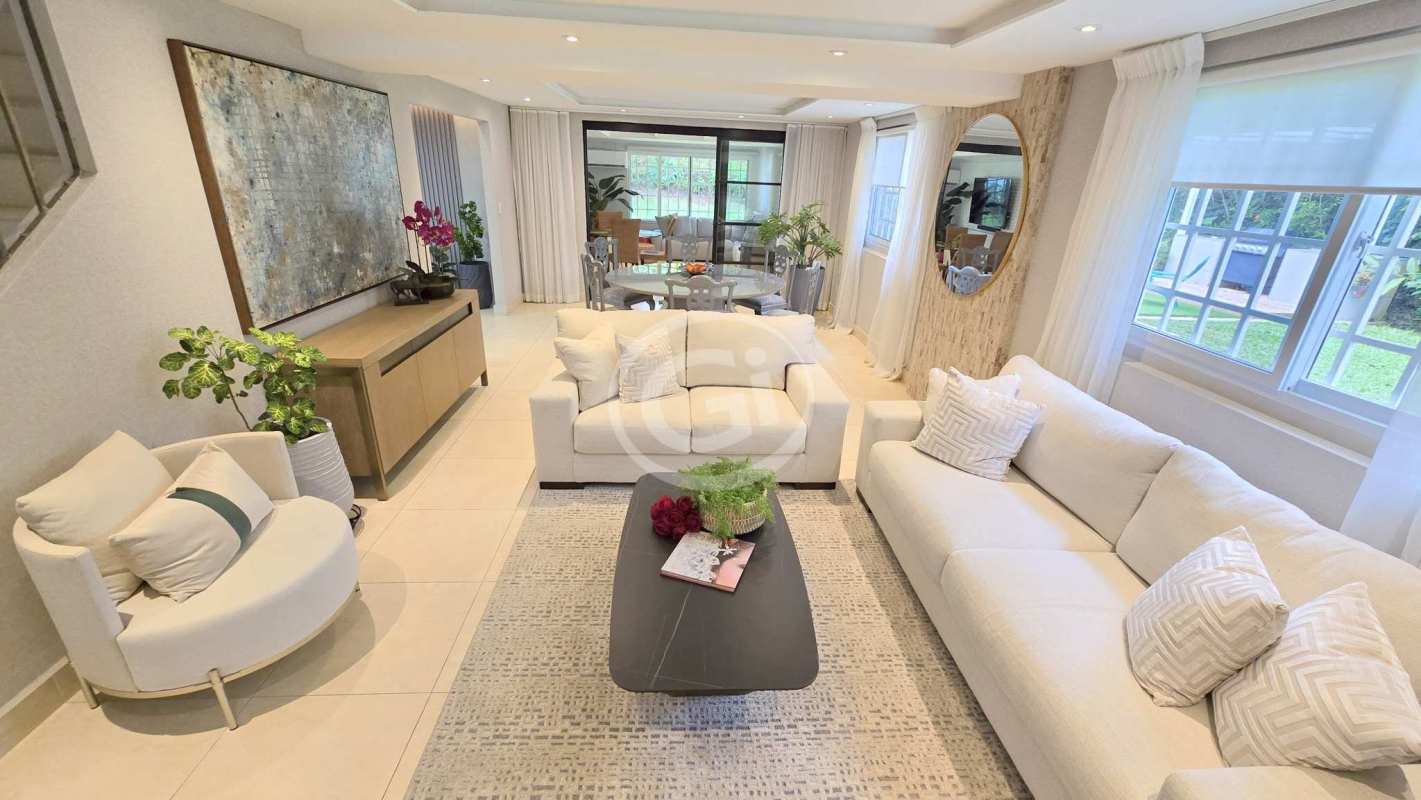 Open living area with windows and modern furnishings Cardenas Village Panama