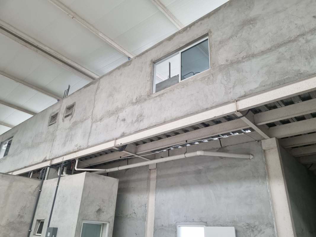 Warehouse industrial interior with large windows exposed beams Pacora Panama