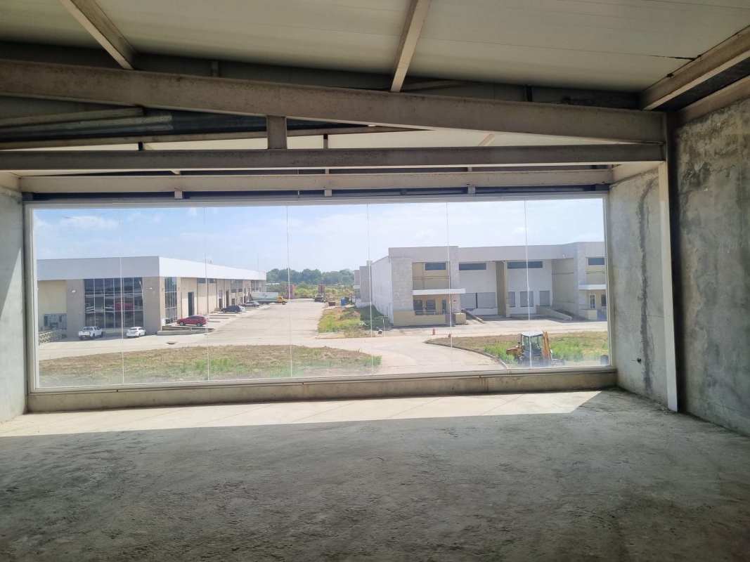 Unfinished warehouse interior with concrete walls metal ceiling Pacora Panama
