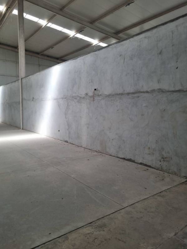 Industrial warehouse interior with large concrete walls steel beams Pacora Panama