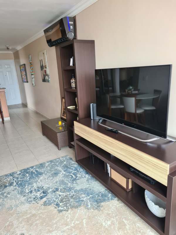 Bright apartment living room with sliding doors to balcony at PH El Marquez Panama City