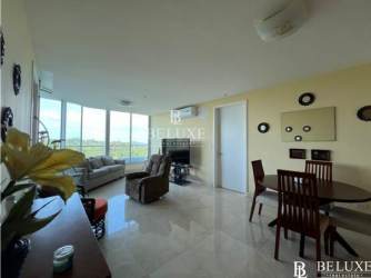 Bright living room with large windows, ceramic tile floor, ocean view balcony access in PH Casa Bonita Veracruz Panama