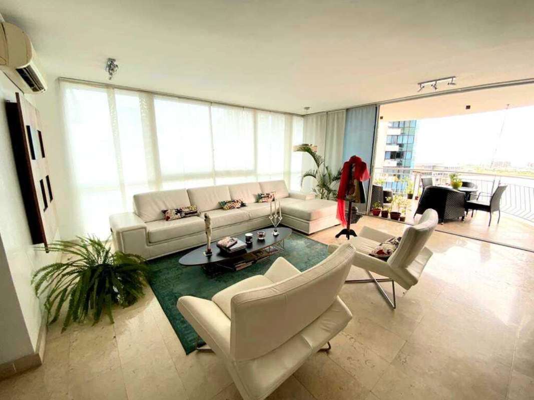 Open plan living and dining with large windows in PH Miramar, Punta Paitilla Panama City