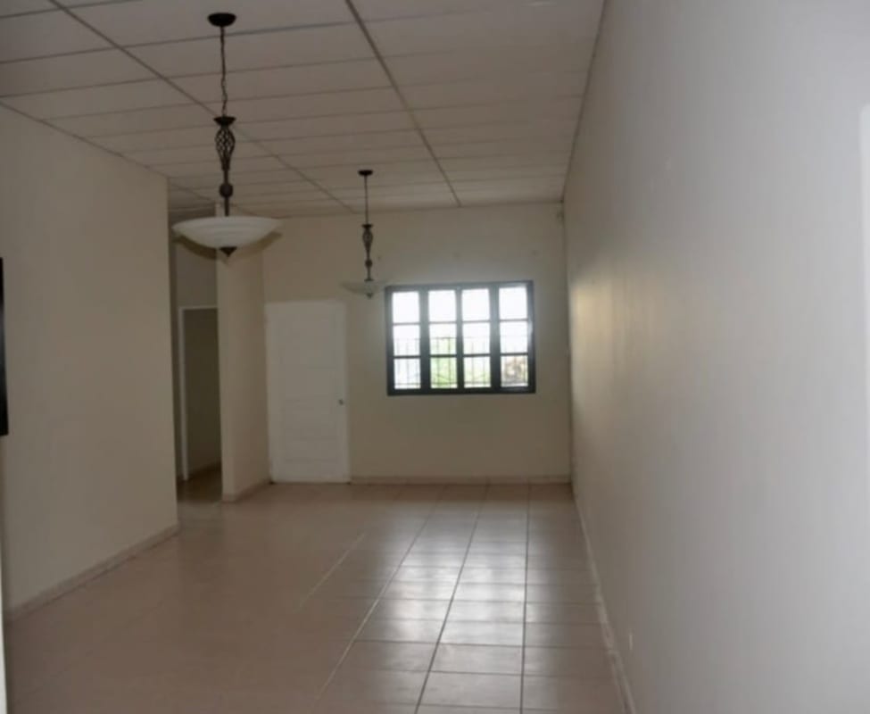 Bright tiled living room space with pendant lights in Villa Bella, Las Cumbres Panama