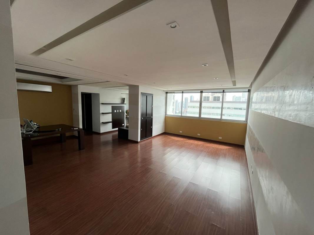 Kitchen with granite countertops and wooden cabinets at PH Infinity Tower San Francisco