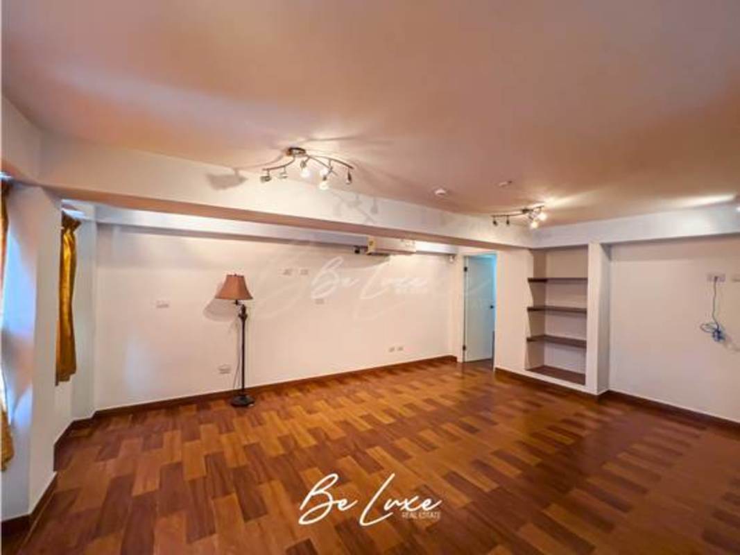 Elegant dining room with high ceilings, large windows, chandelier and tile floors in Panama luxury home