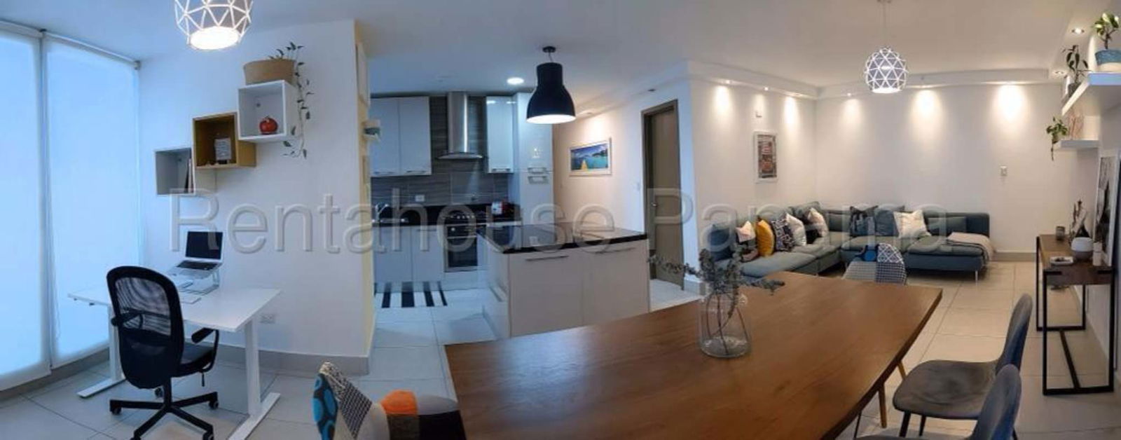 Modern bedroom with floor-to-ceiling windows and city skyline view in Park City Obarrio Panama City