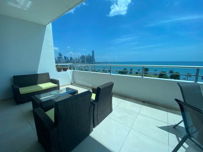 Dining space overlooking ocean and skyline in modern apartment PH Vista del Mar Panama