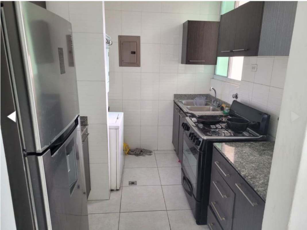 Compact galley kitchen with granite countertops, appliances and cabinetry PH Torre Vivendi Edison Park Panama