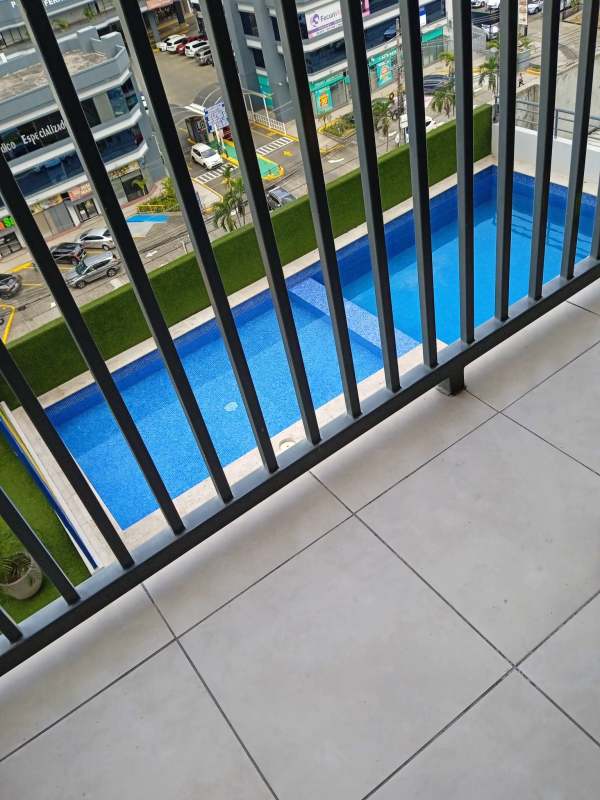 Balcony overlooking swimming pool and city at PH Alai Carrasquilla Panama