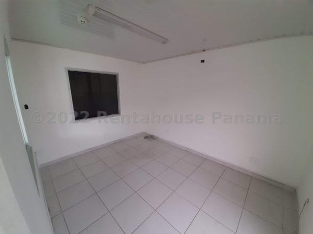 Integrated office space with glass windows inside commercial warehouse Panama