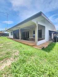 Kitchen with granite countertop and white cabinetry in rental house Chitré Panama