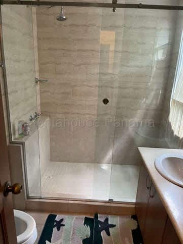 Bathroom featuring double sinks, large mirror, walk-in shower in PH Amador Hill Panama City