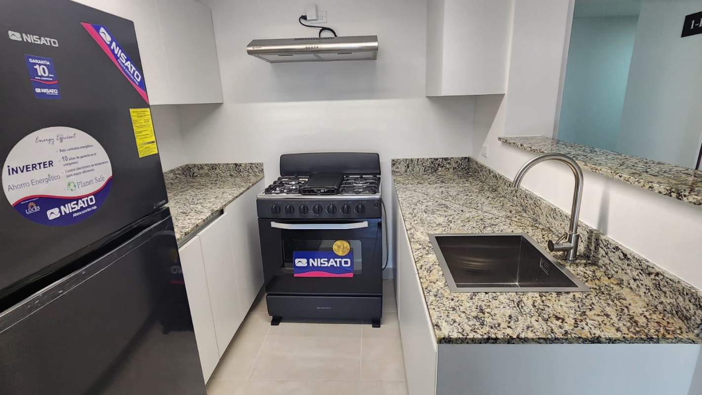 Furnished open kitchen granite countertops in PH Panamá Viejo Residences Parque Lefevre Panama City