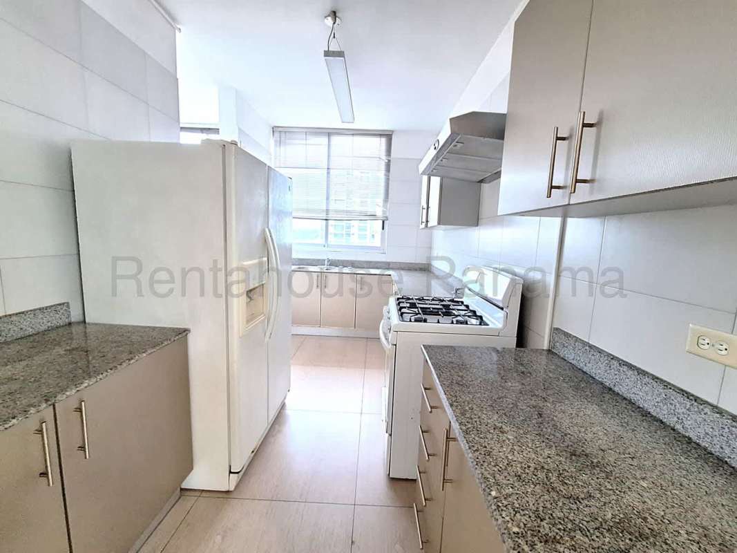 Spacious kitchen with granite countertops, gas stove, modern cabinets in PH Vista Balboa Panama City