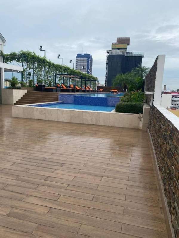 Infinity swimming pool with views of Panama Bay and city skyline at PH Rivage Panama