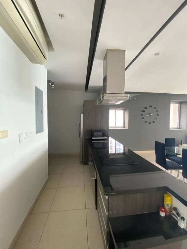 Kitchen with granite island, appliances and dining area view in PH Rivage Panama