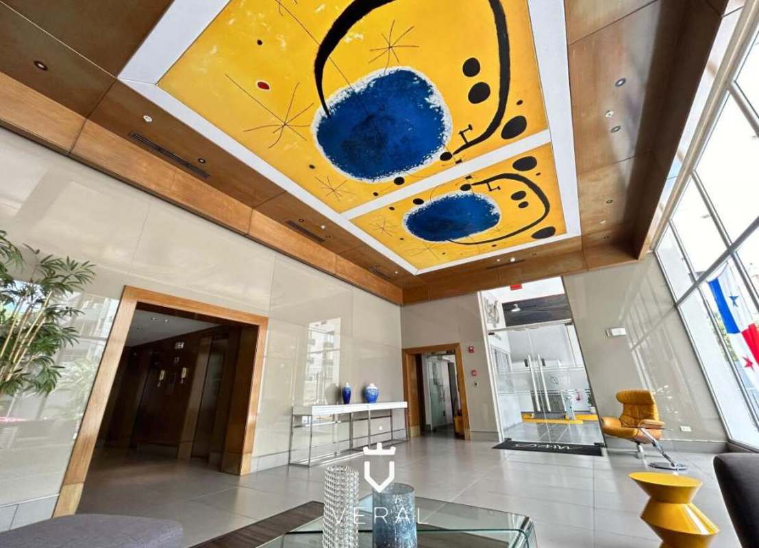 Spacious lobby with reception and lounge seating PH Miró Condo El Cangrejo Panama