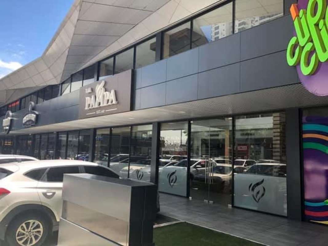 Retail spaces with glass windows and signage at Ocean Drive Plaza Costa del Este