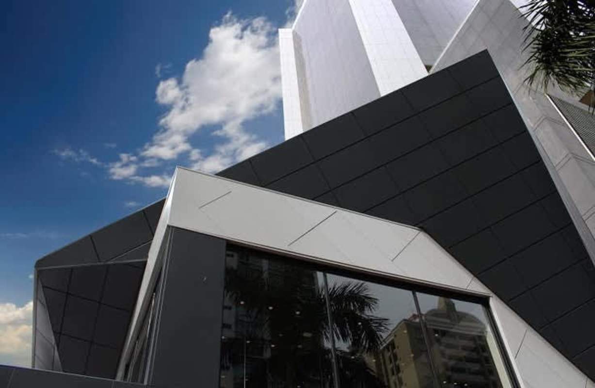 Modern commercial plaza with geometric design large glass panels Ocean Drive