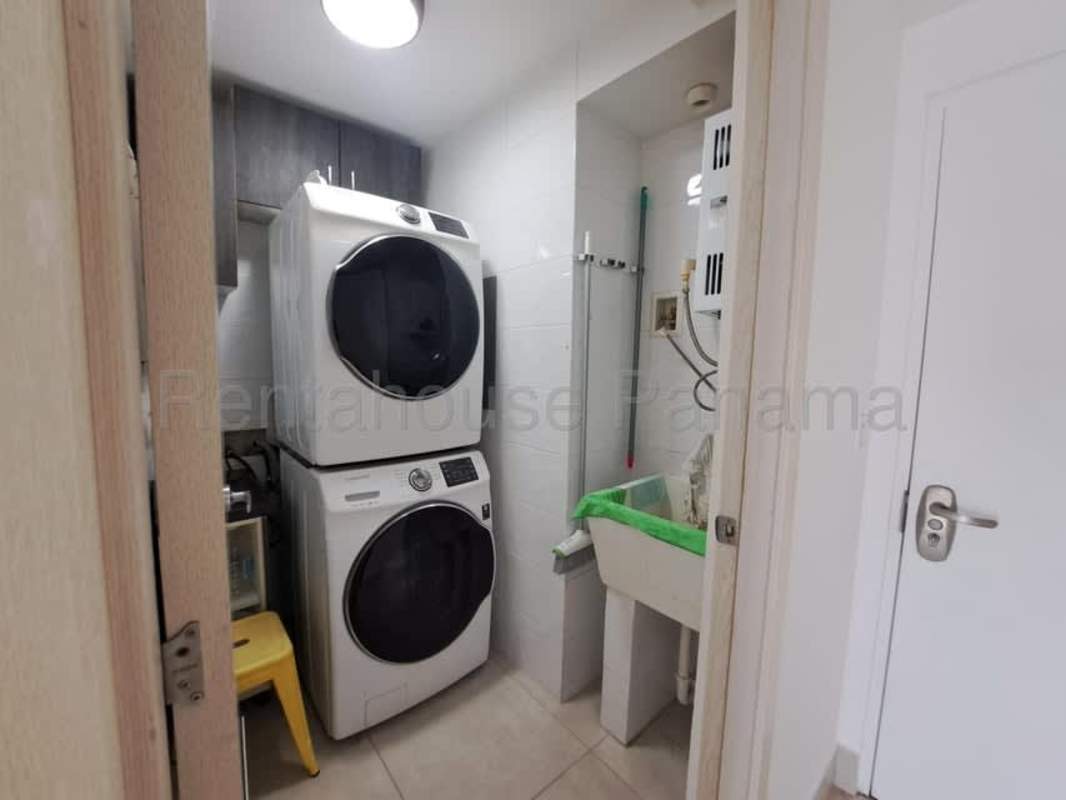 Stacked washer dryer and laundry sink in apartment PH Pacific Park Panama