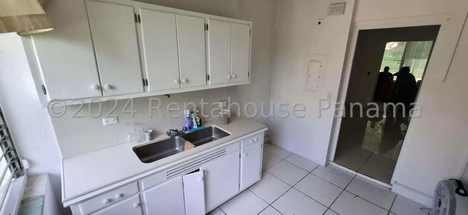 Open layout living and dining room with tile floors in Balboa Ancon apartment Panama City