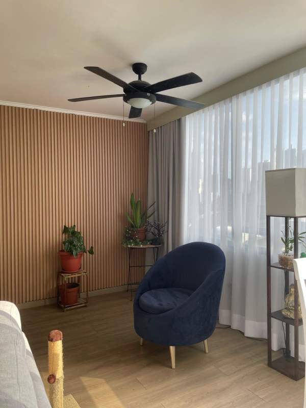 Large master bedroom featuring ensuite bathroom and city views PH Park Loft apartment Obarrio Panama