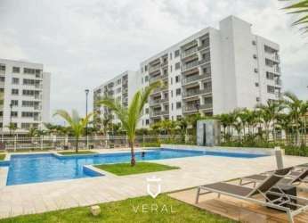 Outdoor pool area with lush landscaping in PH Midrise Panama Pacifico