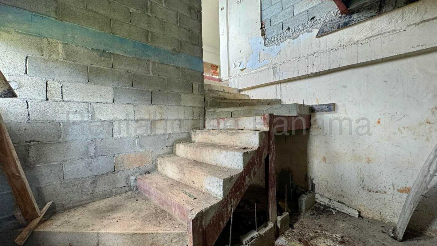 Unfinished stairwell with concrete steps inside Panama house for sale