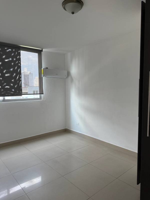 Bedroom with large window and city skyline view PH Teus Tower Panama City