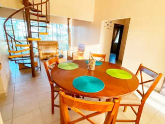 Living room with spiral stairs wooden furniture tile floors in El Copé Penonomé