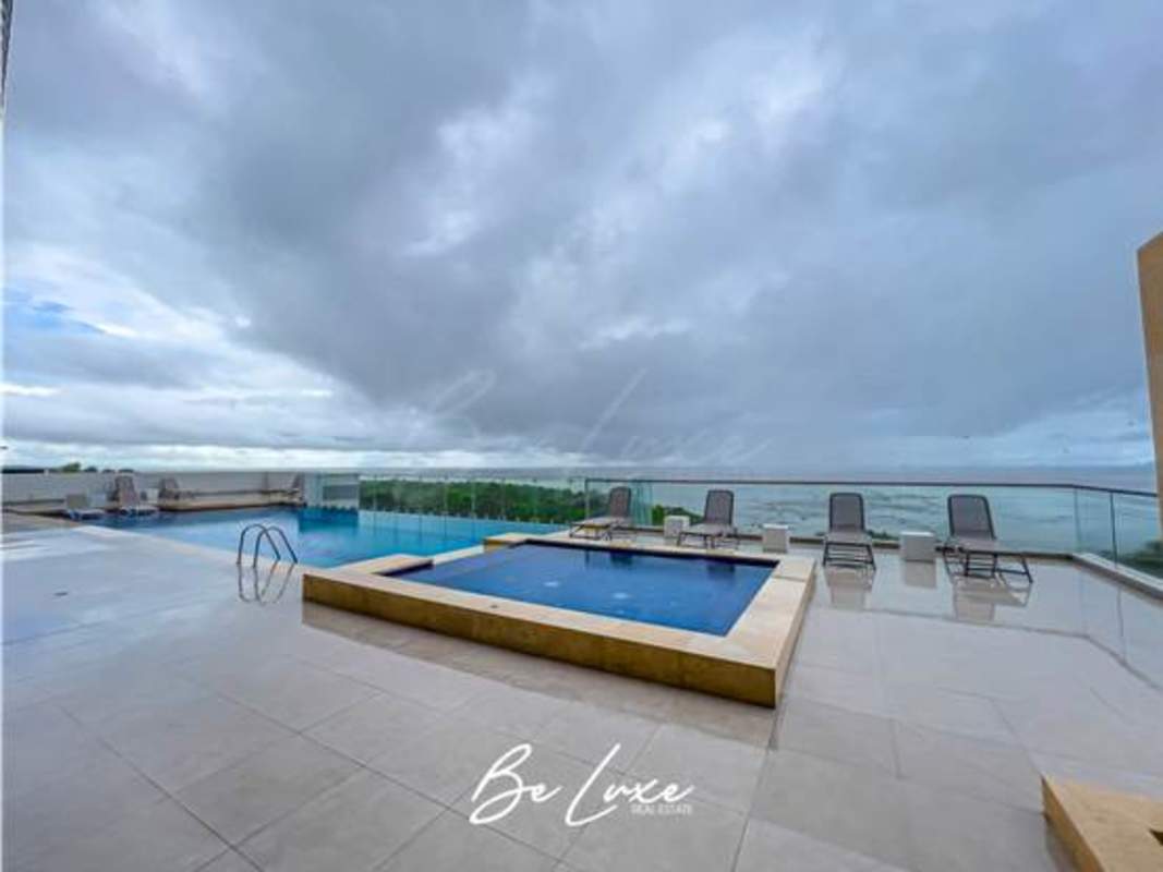 Infinity pool with sea view and modern lounge areas PH Ten Tower Costa del Este Panama