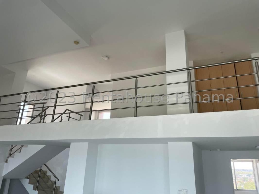 Modern kitchen with granite countertops and wood cabinetry in PH Sevilla Costa del Este