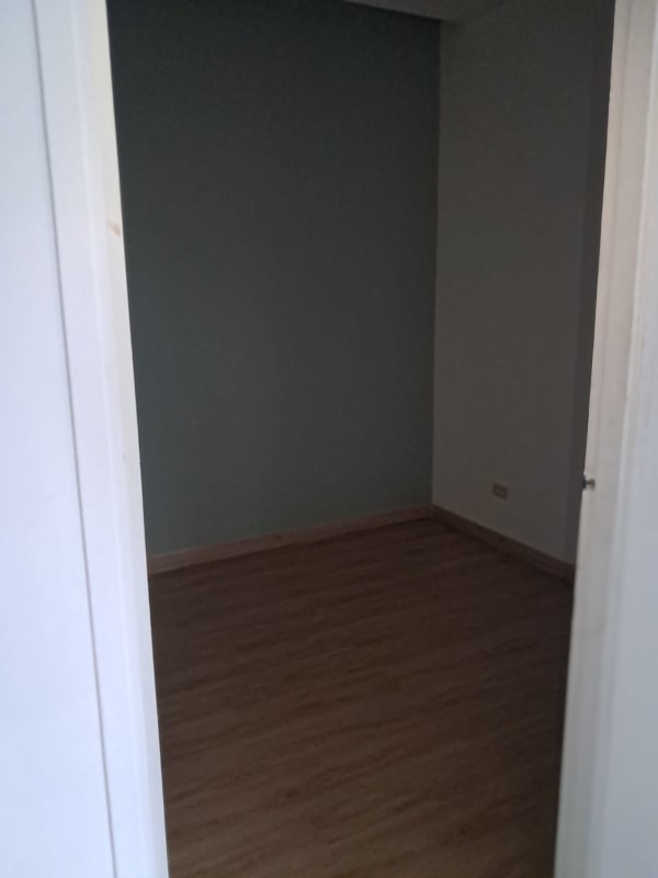 Empty interior retail or office space with tiled floors and white walls in Liberty Plaza Panama City