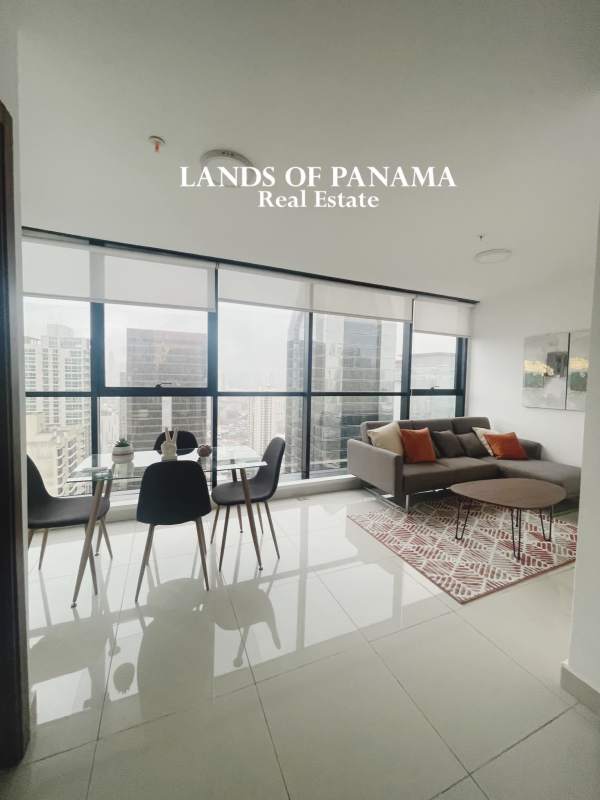 Glass dining table with city skyline backdrop in PH Downtown Obarrio Panama City rental