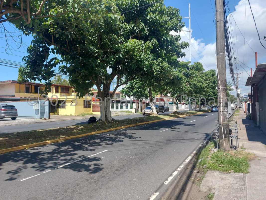 Shared office area with cubicles, shelving, work desks in commercial building Panama