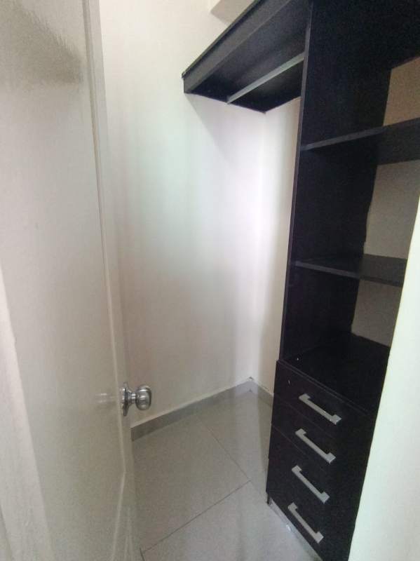 Open-plan living and dining area with large windows and ocean view in Bella Vista Panama City