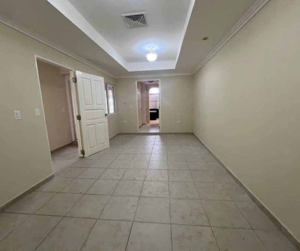 Bright bedroom rental in Chanis Panama with tile floor and closet
