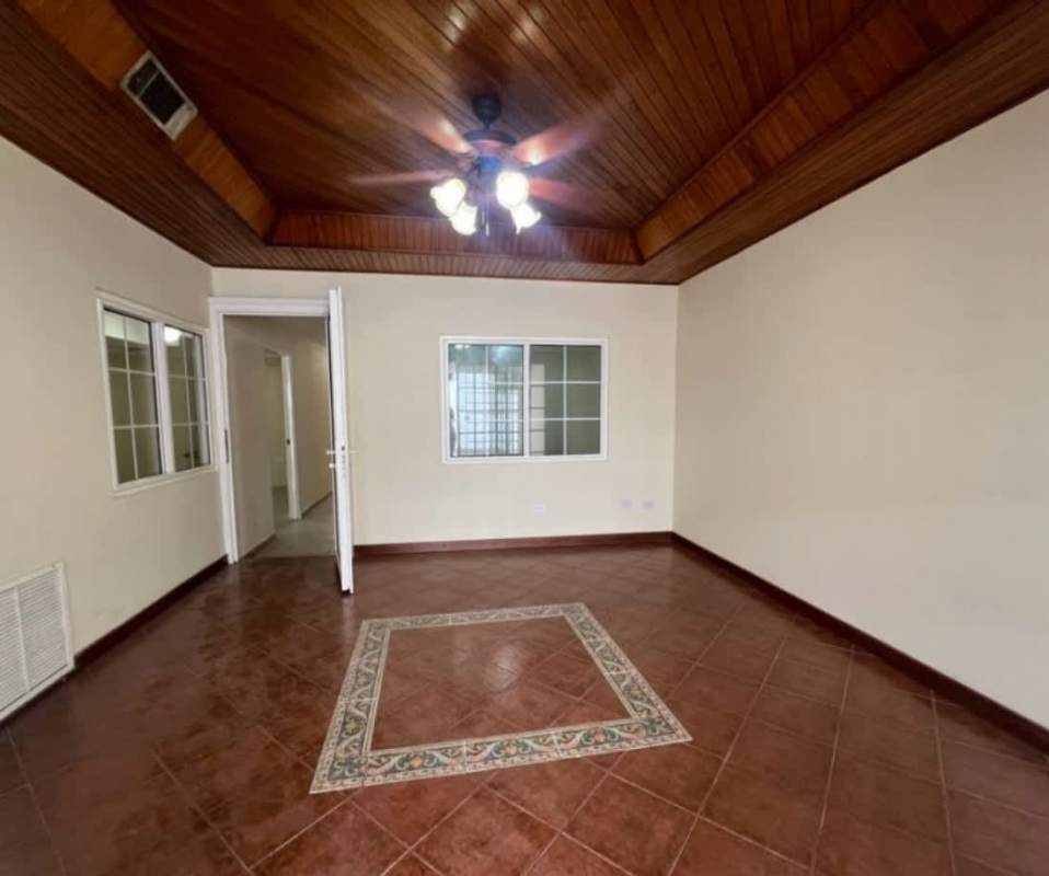 Large living room with vaulted wood ceiling and tile floor Chanis Panama
