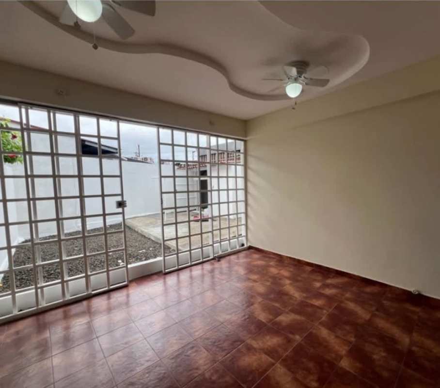 Interior patio or living space with sliding glass doors and ceiling fans Chanis Panama