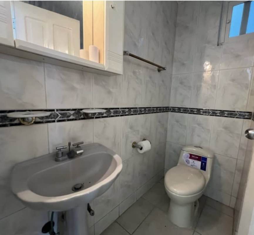 Bathroom with tiled walls and walk-in shower rental house Chanis Panama