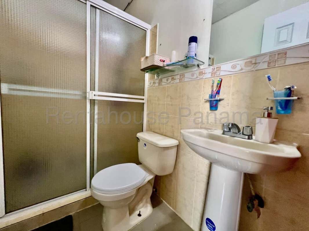 Living and dining area with tile floor in Las Cumbres Panama house for sale