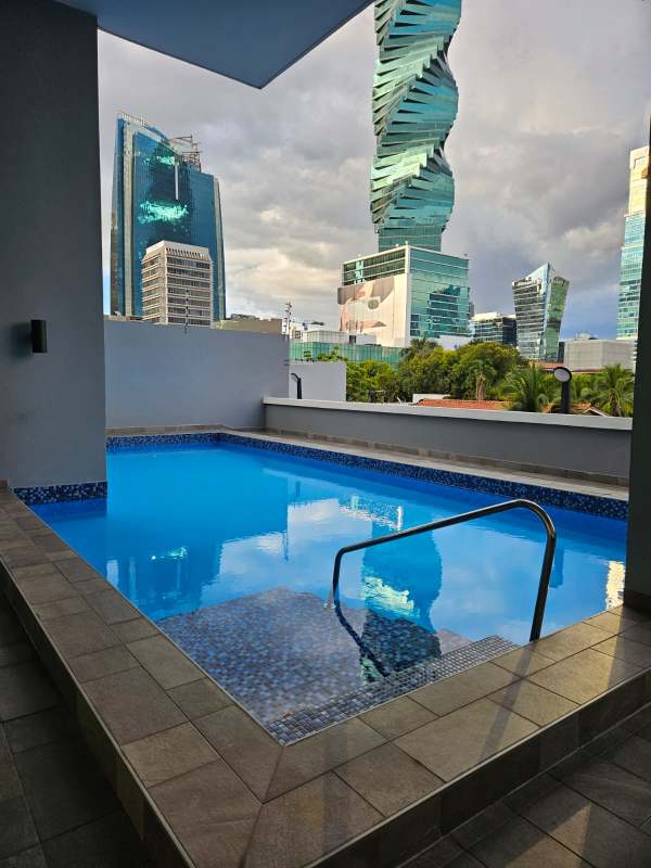 Outdoor swimming pool with skyline backdrop, Marbella Tower Panama